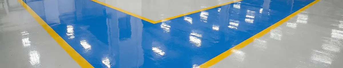 A factory floor professionally covered and marked with epoxy flooring in Marietta, GA