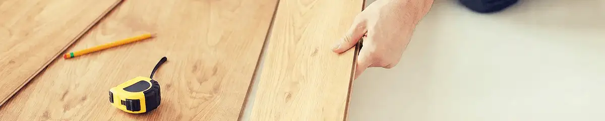 A professional installing wood flooring in Marietta, GA