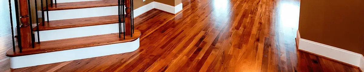Base floor of a staircase with professionally restored wood flooring in Marietta GA