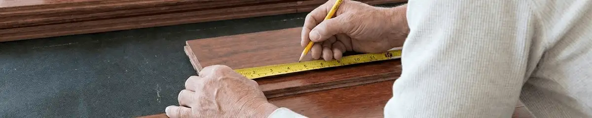 A professional installing wood flooring in Marietta, GA